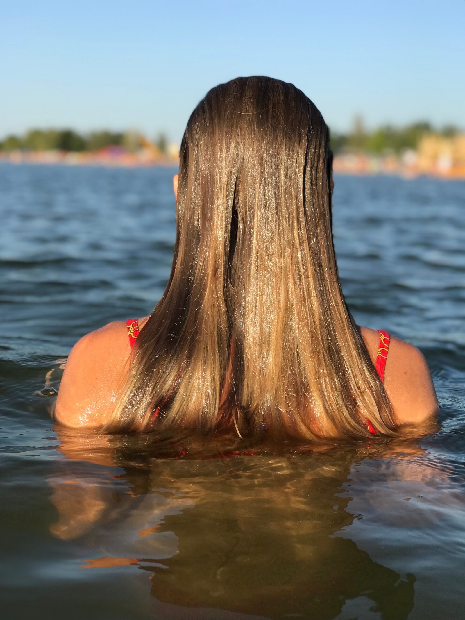 Wet blonde hair after swimming in a pool